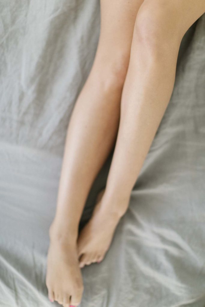 image of a woman laying on a bed 