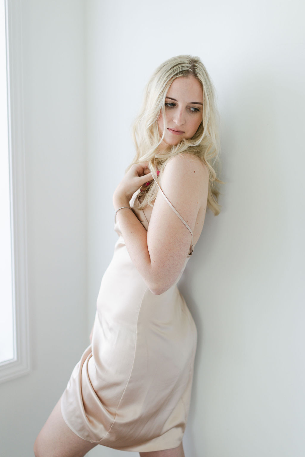 blonde haired woman during modern boudoir portrait session
